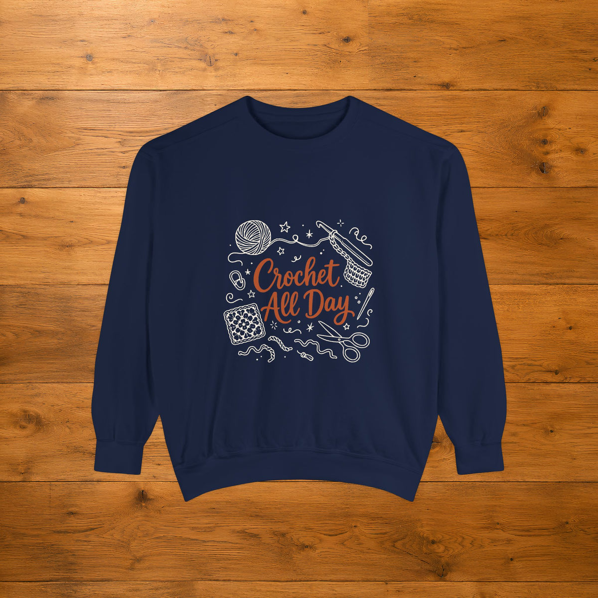 True Navy Crochet All Day crewneck sweatshirt laid flat on a wooden table